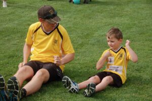 Canberra Sprint Coach, Steve Dodt, teaching the art of hurdling to the next generation at Little Athletics