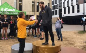 Canberra Sprint Coach, Steve Dodt, presenting awards at the UC Mini Olympics